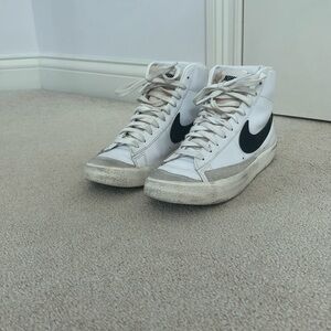 White Nike blazers with black Nike symbol